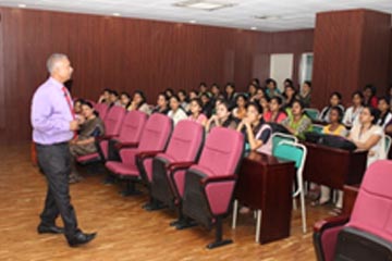 Dr Balamurugan delivering a lecture to Management students of Don Bosco Management school